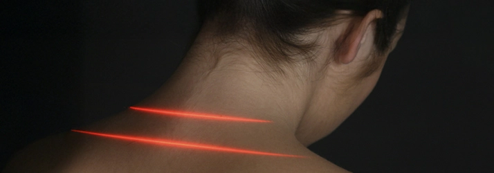 Chiropractic Bakersfield CA Cold Laser Cold laser therapy on patients neck.