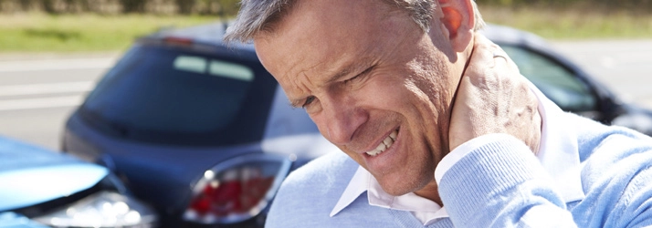 Man with neck pain after accident needing chiropractic treatment Man with neck pain after accident needing chiropractic treatment